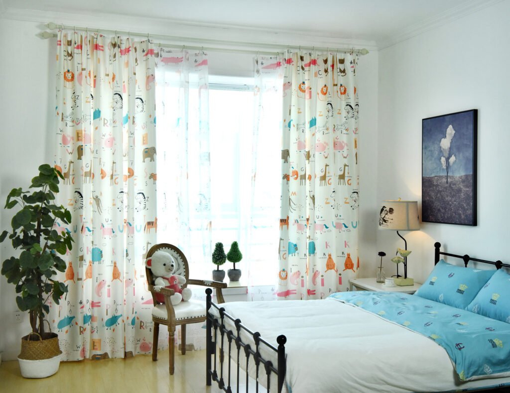 Bright bedroom with cartoon curtains