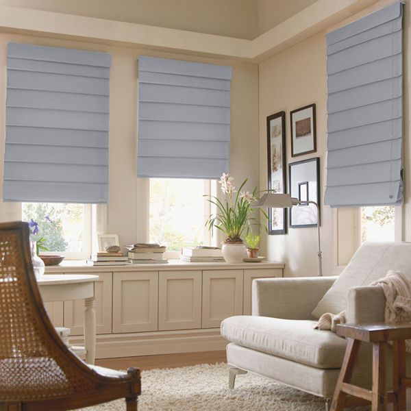 Soft gray Roman blinds in a cozy Room